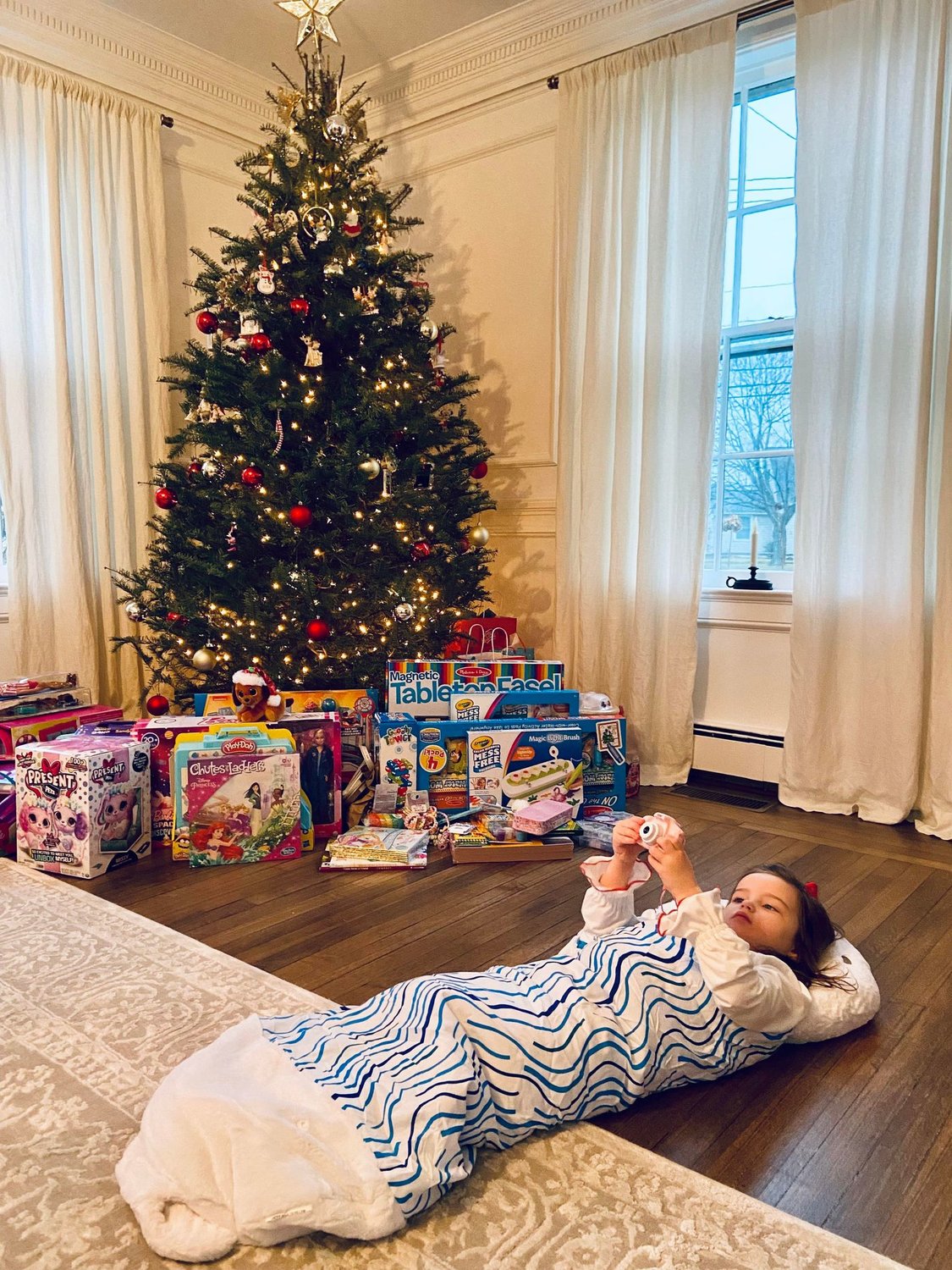 Olivia, 3, Bayport
“Her first year knowing Santa.”